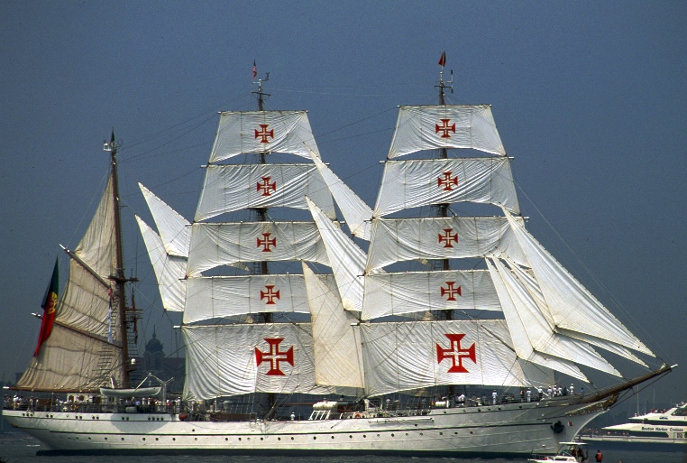 a large white sailing boat on a body of water