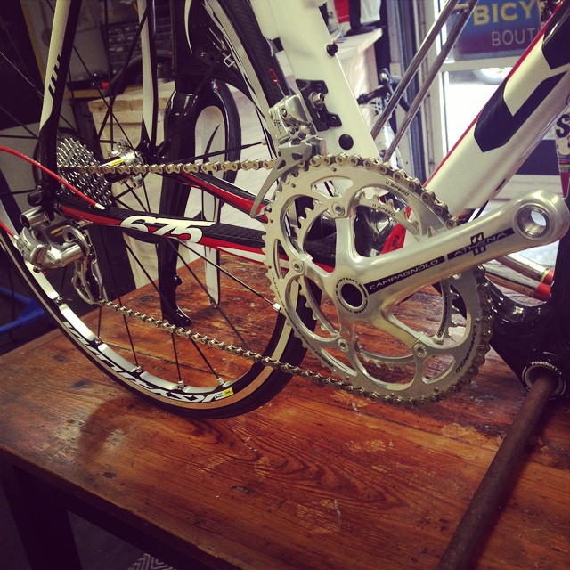 this bike is parked on a table with other bikes