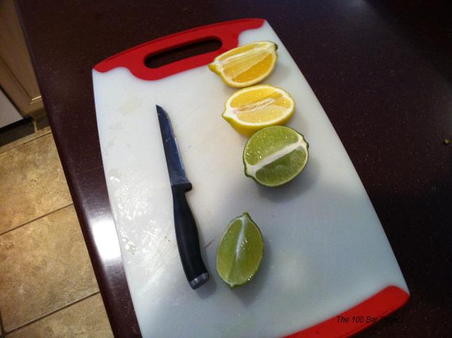 a  board with sliced lemons and a knife