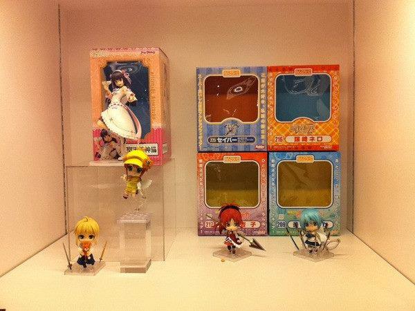 some toy figurines are on display in boxes