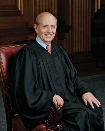 a judge in an empty chair wearing a gown