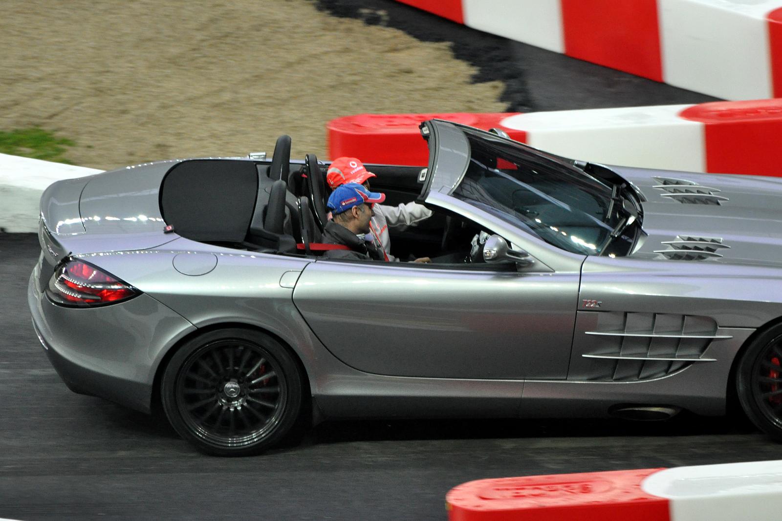 an image of a person driving a silver car