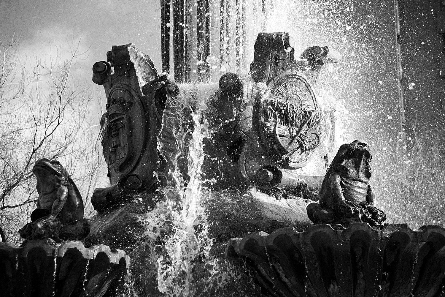 a black and white po of people sitting in the water