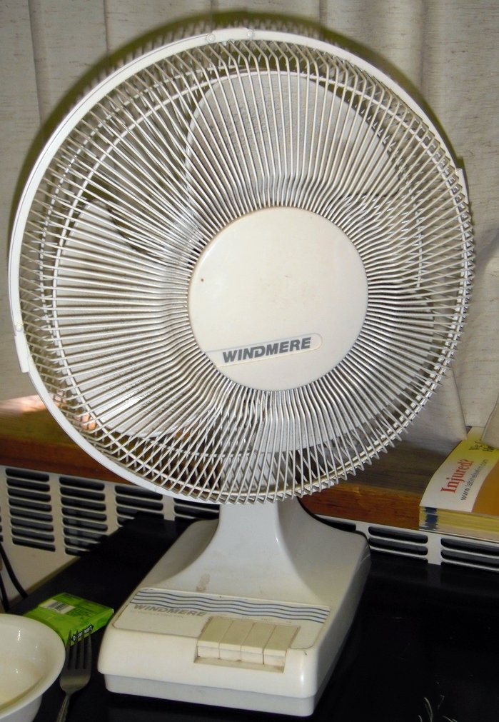 a white fan on top of a table