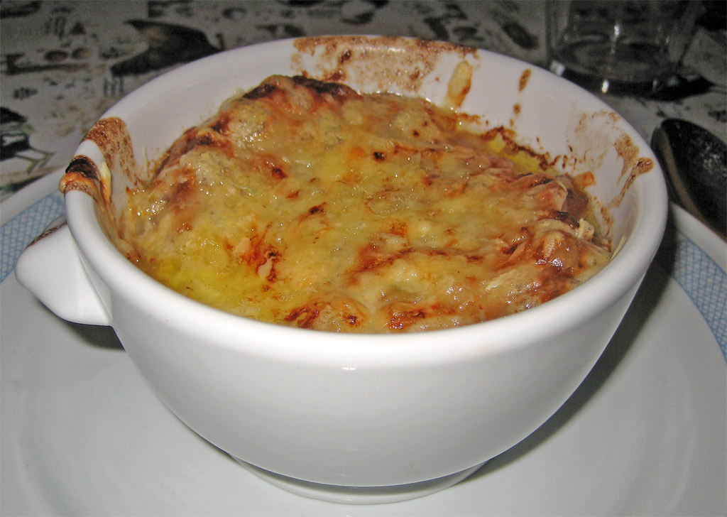 a casserole dish full of chicken and cheese