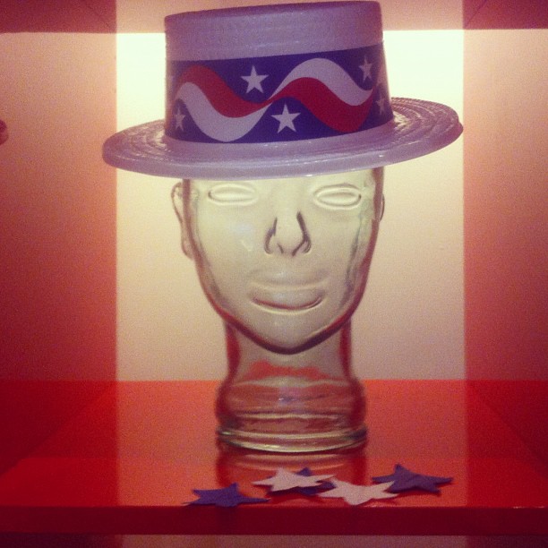 a dummy head wearing a hat with the flag painted on it