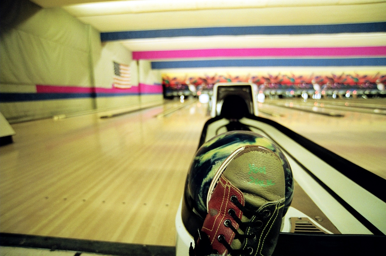 the person is skating at a large bowling alley