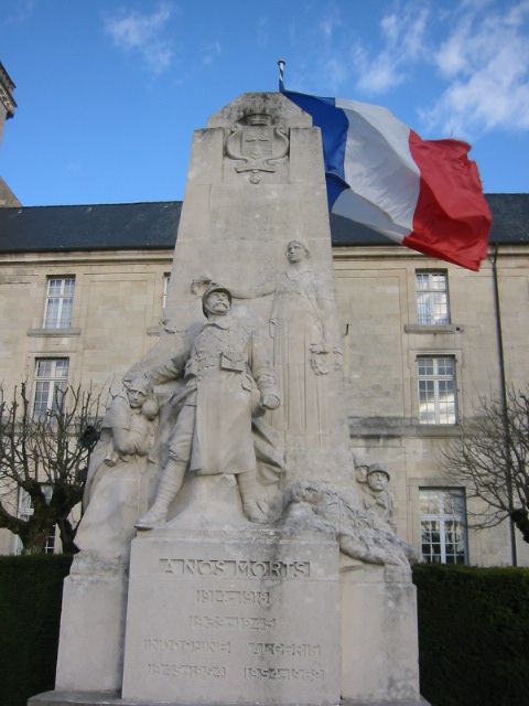the statue is beside the flag of france