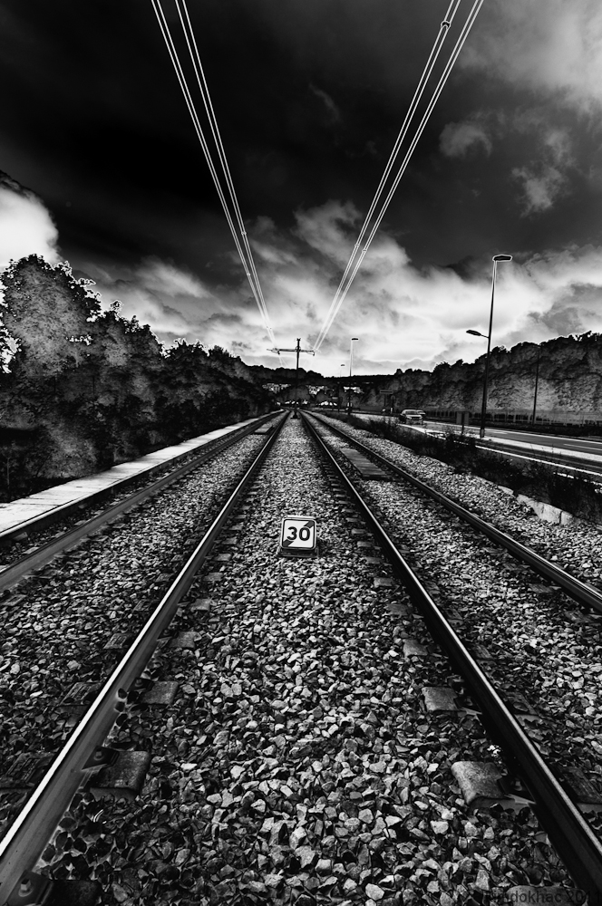 a black and white po of train tracks