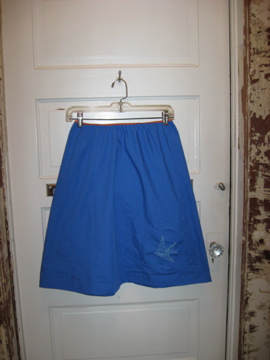 a pair of blue shorts hanging on the door