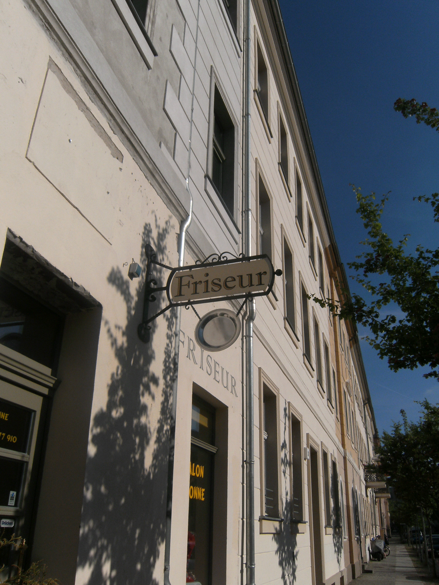 a building with signs hanging on it