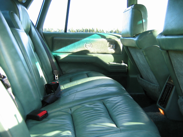 a leather seat sits in the passenger side area of a car