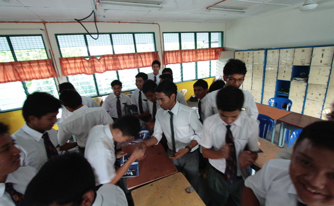 a classroom full of young men with ties on