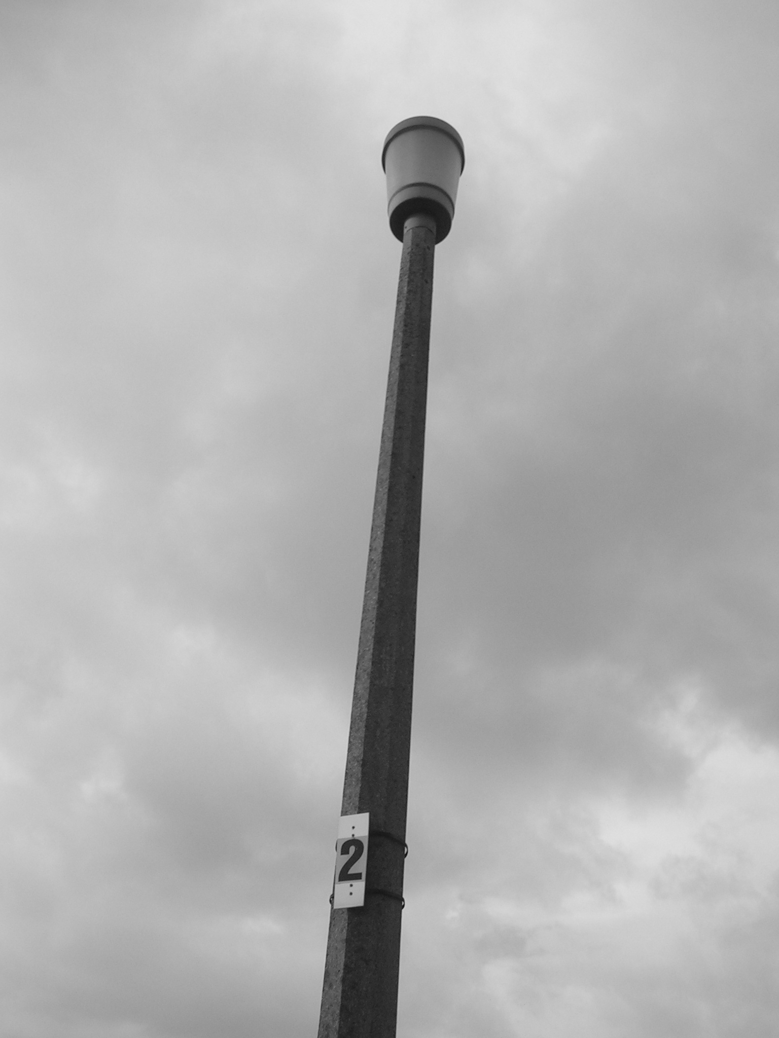 a tall pole with a street light on top