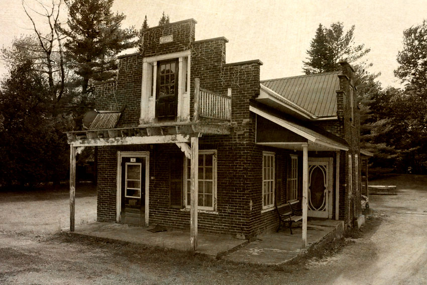 old building with porch on other side of the house