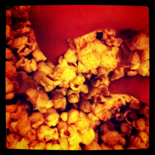 a bunch of popcorn on the ground in a square picture
