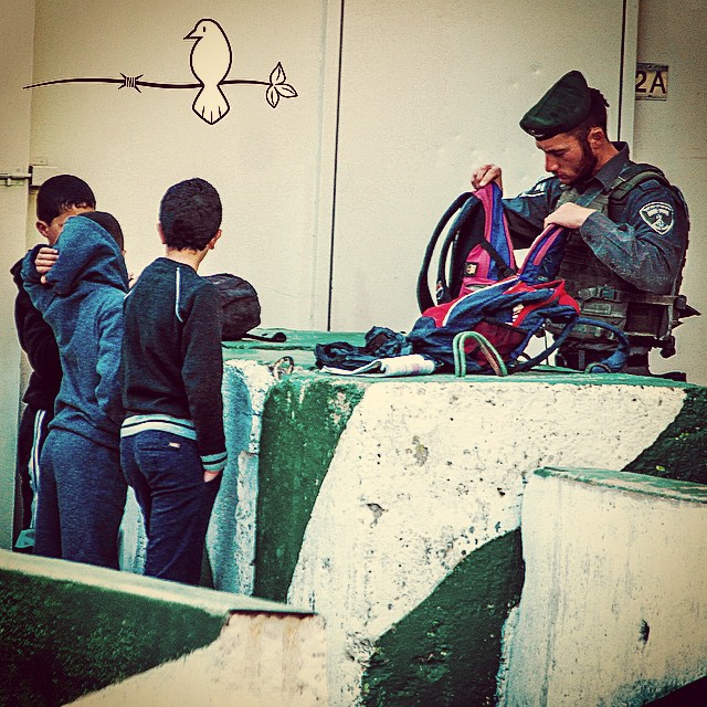 an officer standing with s in the street