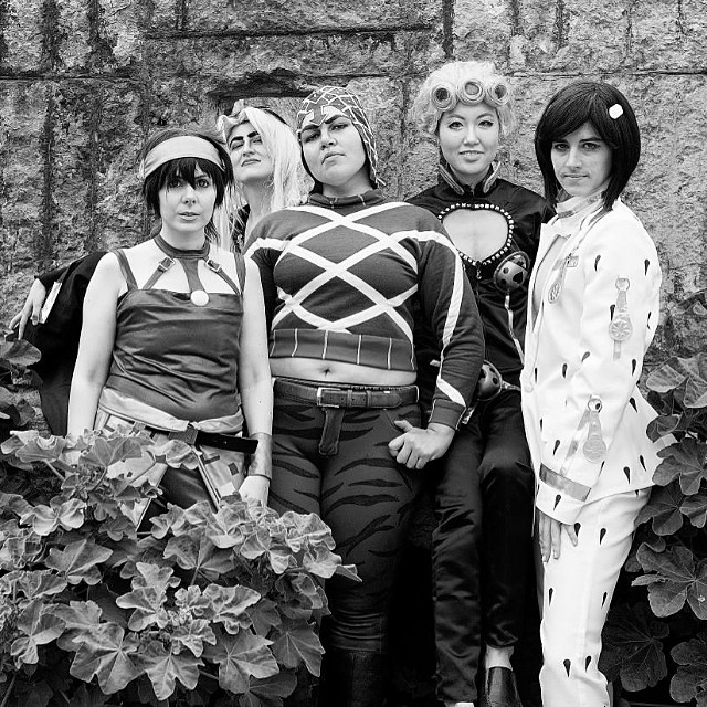 black and white po of six people dressed as cosplay