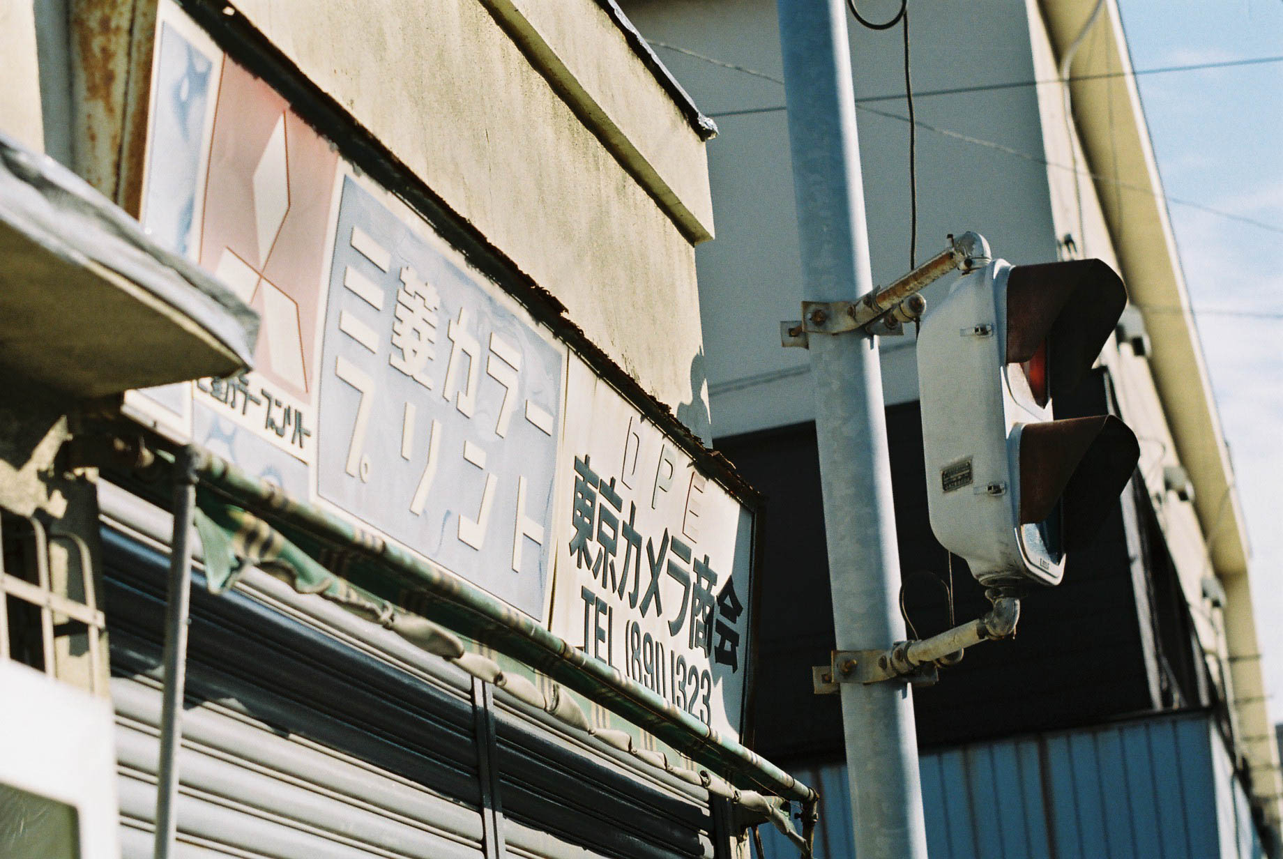 two streetlights hanging off the side of a building