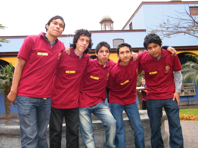 a group of young men pose for a po