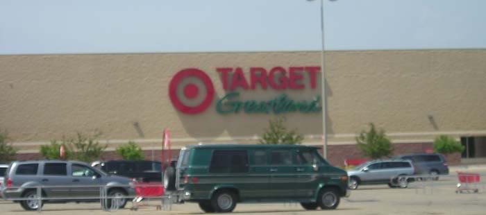 a green van parked in front of a target store