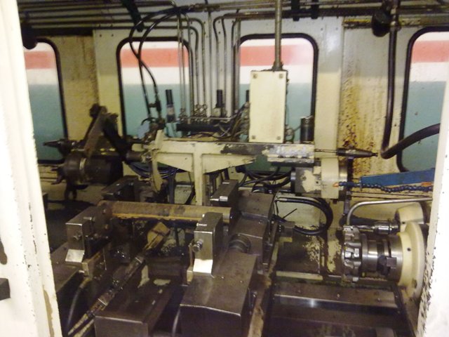 the inside of a machine shop with several machines in it