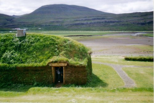 a grass hut is in the middle of nowhere