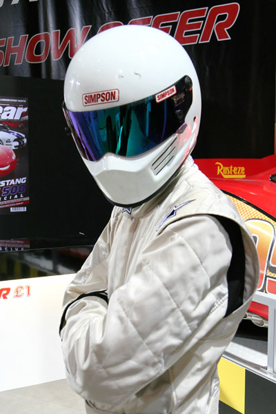 a person in a helmet and a white outfit