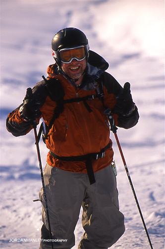 a man on skis posing for the camera