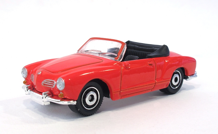a toy red car with a black top and a black roof