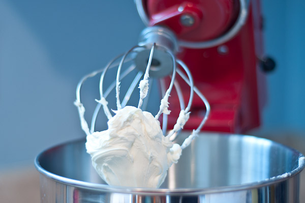 an electric mixer sitting on top of a kitchen counter