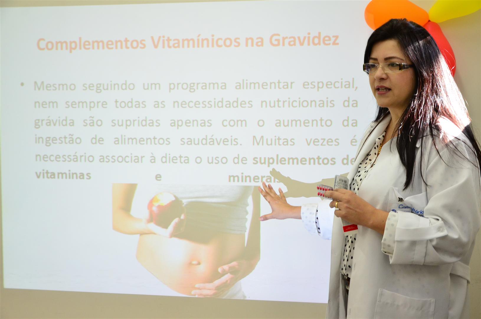 a woman is giving a presentation to students