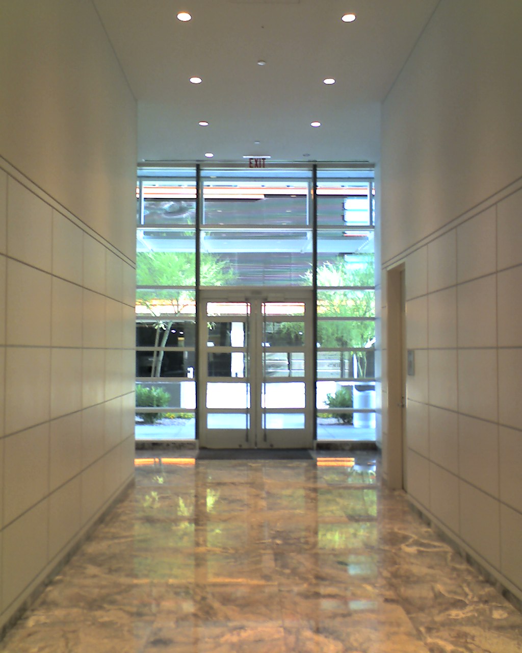 a hallway with the entrance to an office building