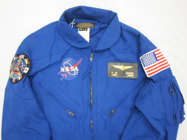 a jacket with patches and a flag on it