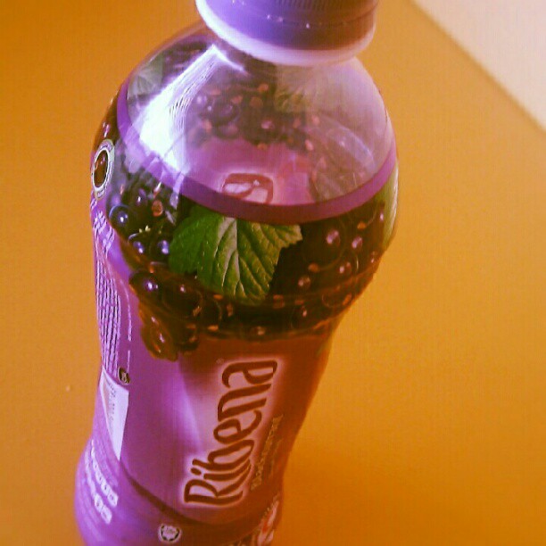 a small plastic bottle with some fruit inside
