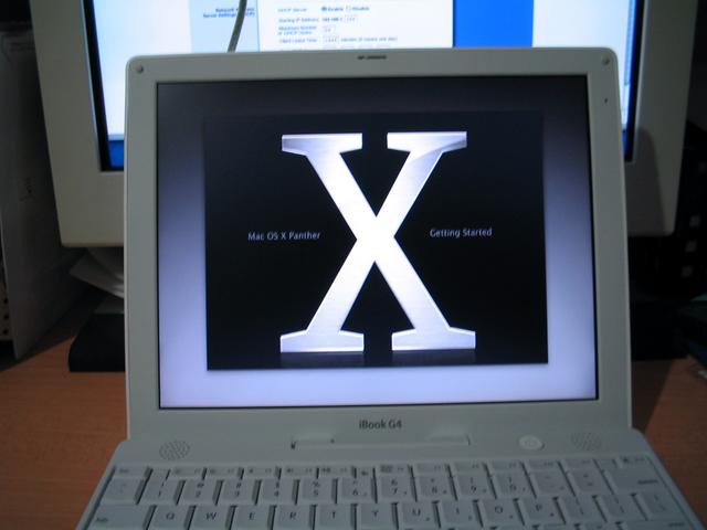 there is a desktop computer with the letter x on it