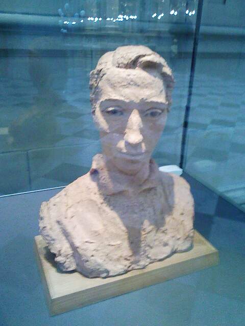 an old plaster bust of a person