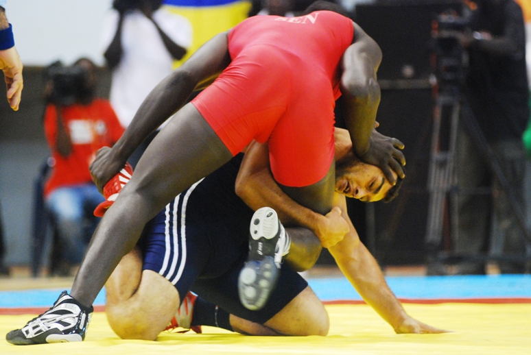 a wrestling match with the wrestlers wrestling during the bout
