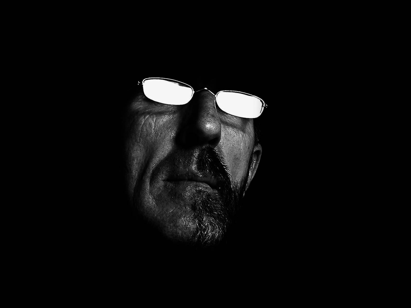 a man's eyes are covered by glowing glasses