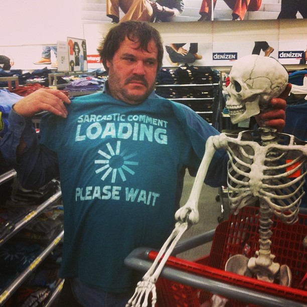 man wearing a t - shirt that says loading please wait