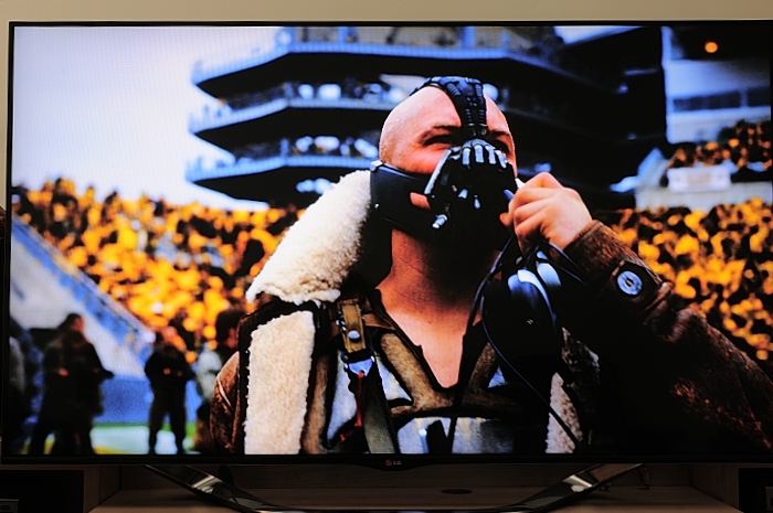 a man taking pictures on the tv screen