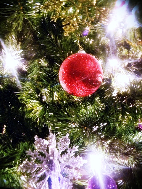 the christmas tree has some decorations on it
