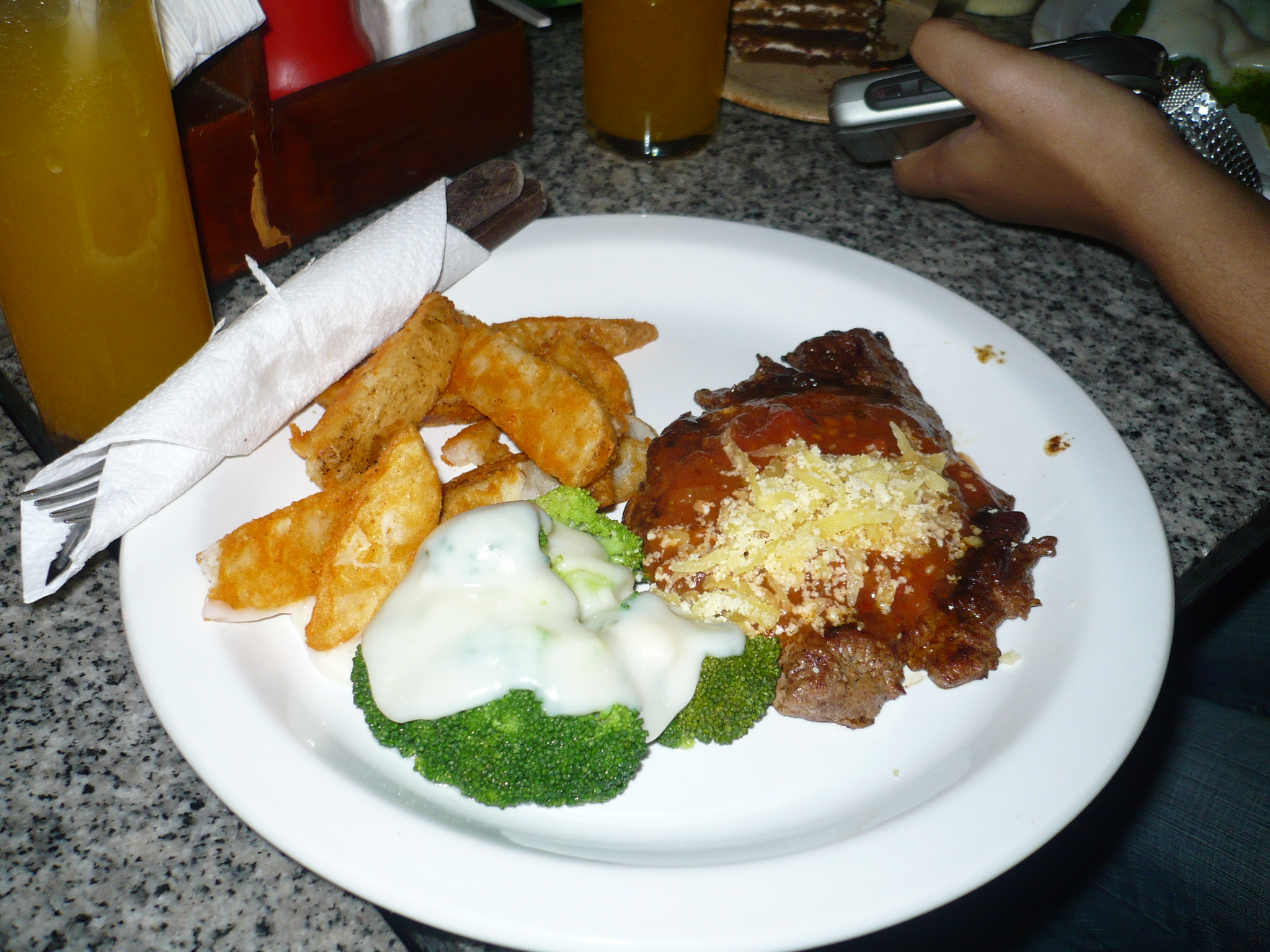 a plate with a lot of food on it sitting next to some cups