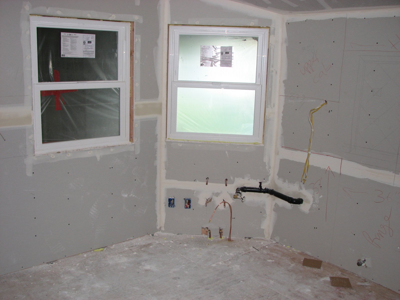 a picture of an unfinished bathroom with a shower tub