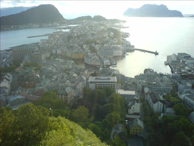 an aerial view shows the mountains, houses and sea