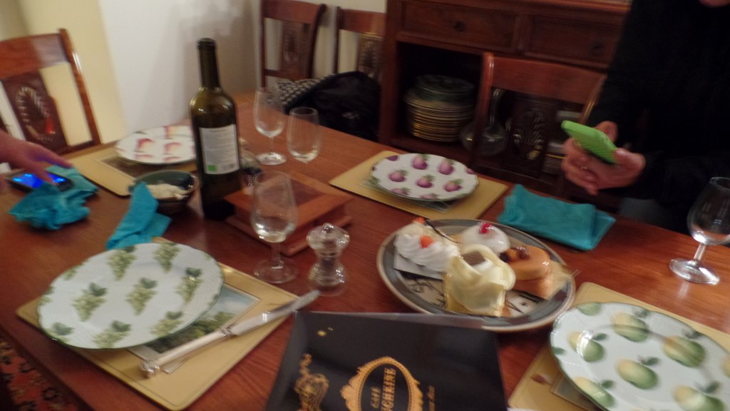 some plates of food on a table and a bottle