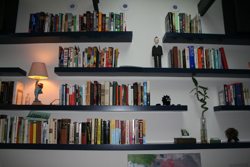 a bookshelf with lots of different books on it