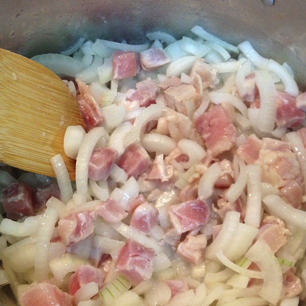 a large pot full of chopped meat and onions