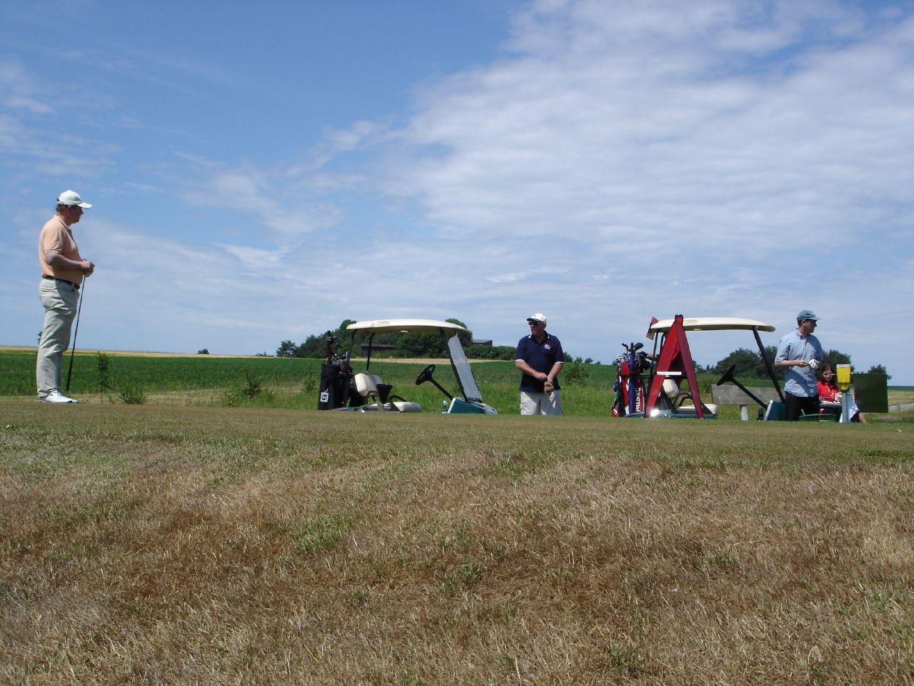 a group of people who are sitting in the grass