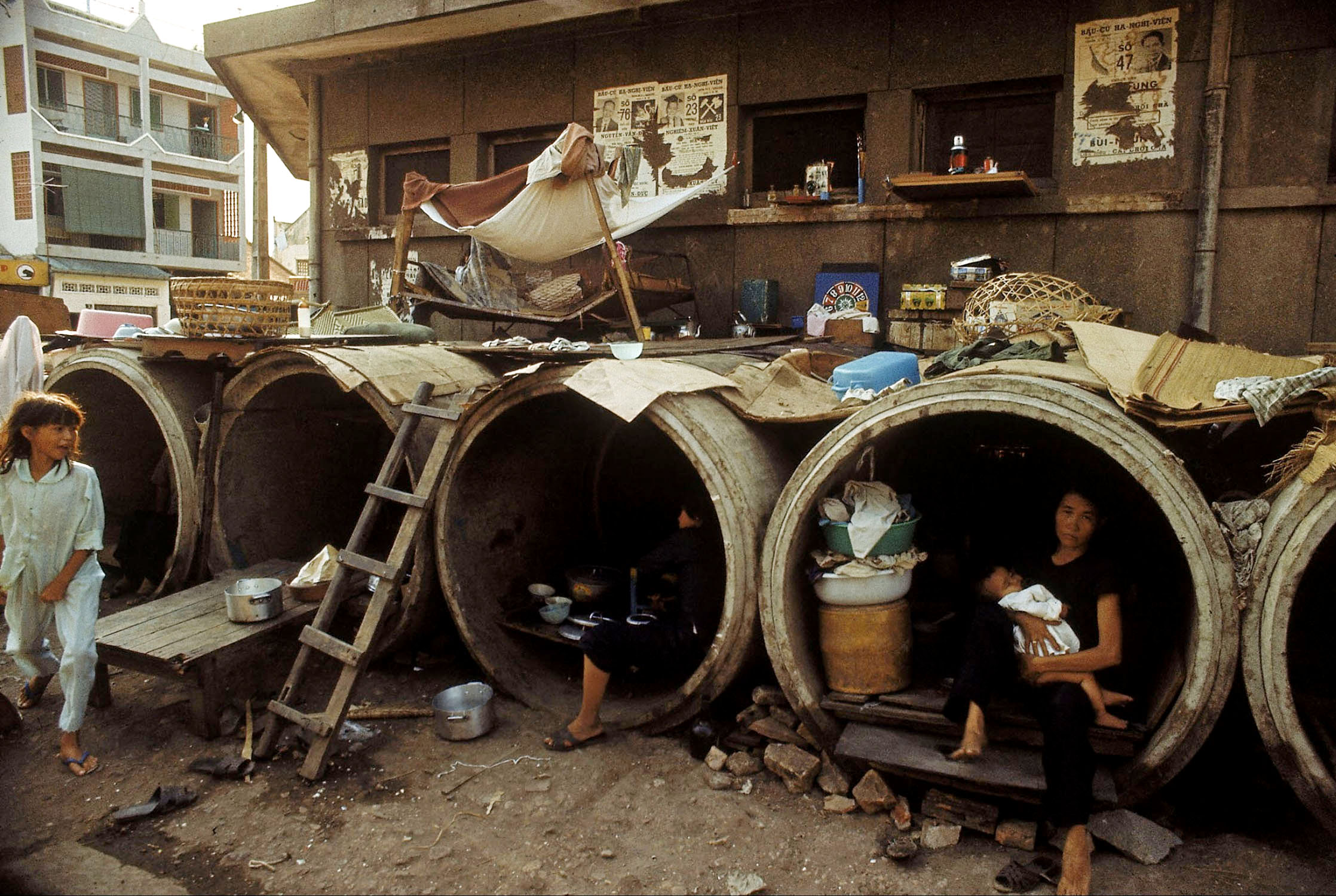 two women in barrels that look like they were set on the ground